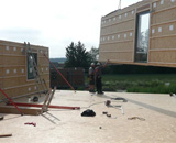 Construction maison bois avec mur préfabriqué