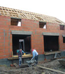 Vue extérieure construction maison ecologique brique G7