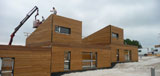 Maison à ossature bois réalisée avec un mur préfabriqué
